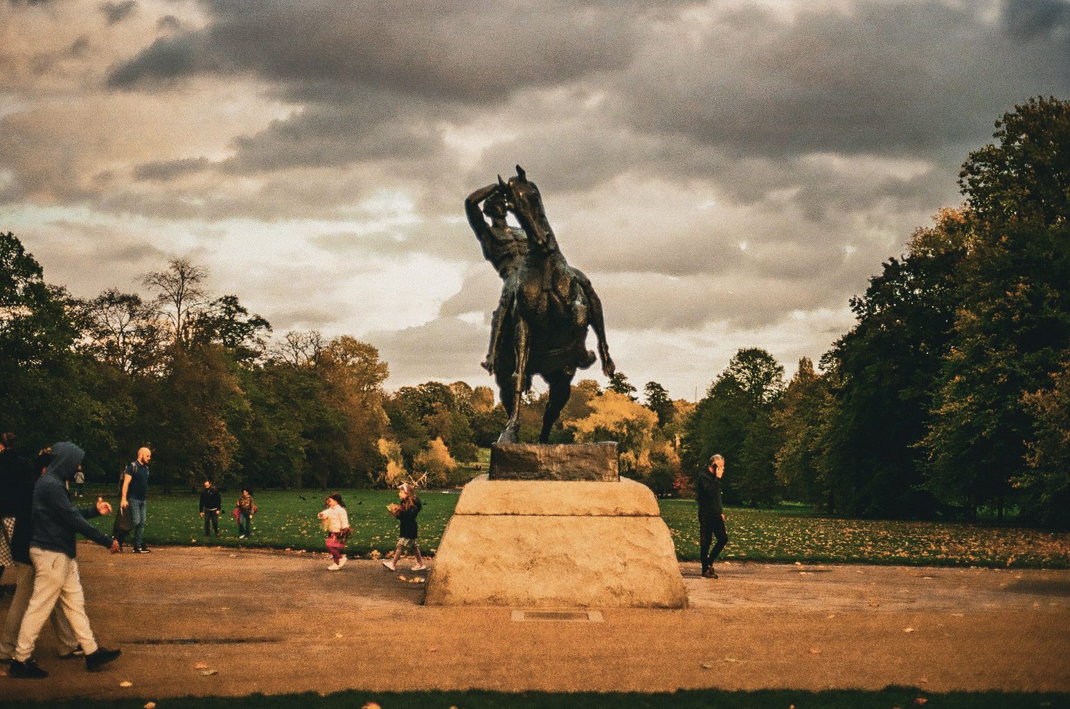 An equestrian statue under a heavy, dramatic sky
